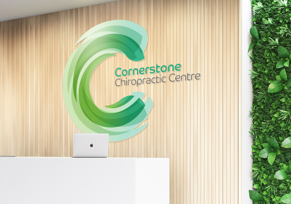 The Cornerstone Chiropractic logo, designed by Mity Digital, as a sign on the reception wall